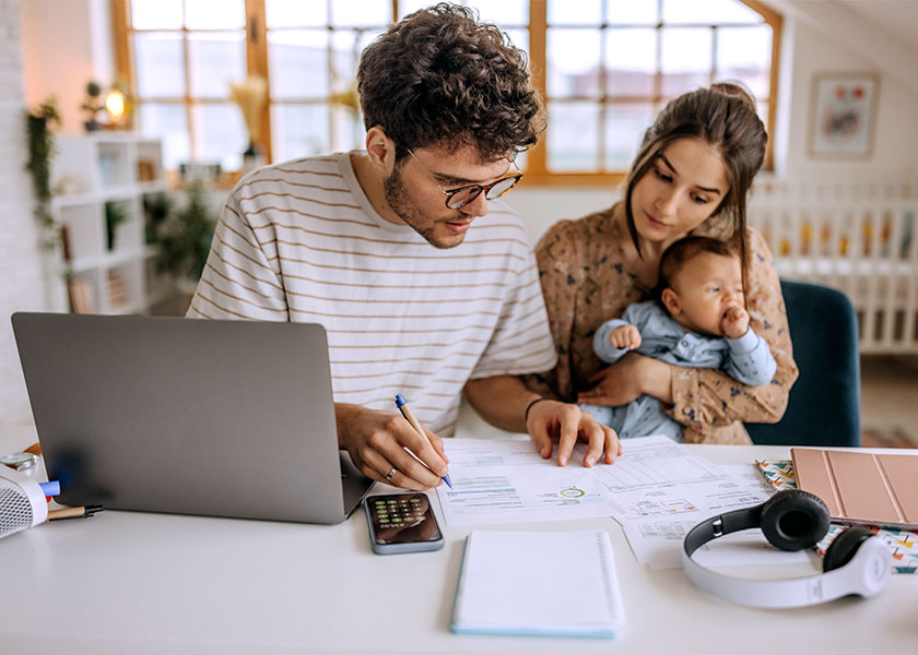 Young family going over their financial plan at home